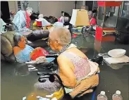  ??  ?? From Timothy J. Mcintosh’s Twitter Residents of La Vita Bella nursing home in Dickinson, Texas, wait for rescue in floodwater­s from Tropical Storm Harvey.