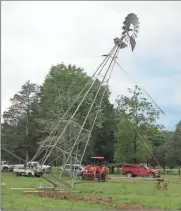  ?? (Catoosa News photo/Tamara Wolk) ?? Randy Garner found a 1935 windmill on Craig’s List and invited friends, family and neighbors to a windmill raising at his Catoosa County farm.