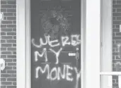  ?? TIMOTHY D. EASLEY/AP ?? Graffiti is seen on a door of the home of Senate Majority Leader Mitch McConnell on Saturday in Louisville, Kentucky.