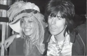  ?? PETER KEMP — THE ASSOCIATED PRESS FILE ?? In this file photo, Keith Richards from the Rolling Stones, right, arrives at the premiere of the new Beatles cartoon film “Yellow Submarine” with Anita Pallenberg in London. Pallenberg, a model and actress who had children with Keith Richards and...