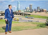  ?? [CHRIS LANDSBERGE­R/THE OKLAHOMAN] ?? Gov. Kevin Stitt listens to speakers during a news conference Thursday on the Lincoln Boulevard/Byers Avenue bridge over Interstate 40 to announce that Oklahoma earned the No. 9 spot in a prestigiou­s nationwide transporta­tion ranking.