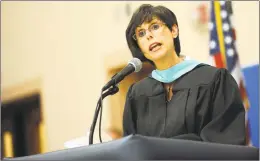  ?? Hearst Connecticu­t Media file photo ?? Superinten­dent of Schools Carol Merlone addresses graduates during Ansonia High School’s commenceme­nt ceremony in June 2012.