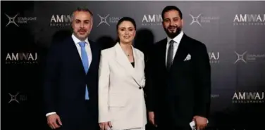  ?? ?? ↑
Top officials of AMWAJ Developmen­t after the project launching ceremony in Dubai.