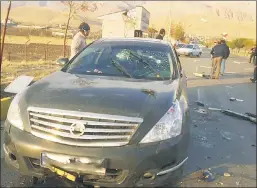  ??  ?? LONG-RANGE KILL: Despite earlier claims of multiple gunmen, new reports say Mohsen Fakhrizade­h and his car (above) were blasted by a remote-powered machine gun in a vehicle 164 yards away, which then blew up.