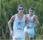  ?? GINNY DIXON/ CORRESPOND­ENT ?? Pembroke Pines Charter’s Carlos Penaranda leads his brother, Daniel, in the District 15- 3A meet at Mills Pond Park in Fort Lauderdale. The twins finished 1 and 2.