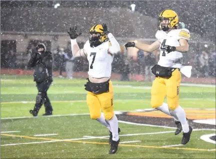  ?? MIKE CABREY — MEDIANEWS GROUP ?? Central Bucks West’s Jack Williams (7) and Eli Boehm (4) get hyped up before the Bucks’ District 1-6A semifinal against Perkiomen Valley on Friday.