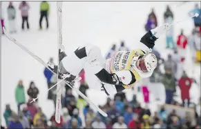  ?? — AP ?? Mikael Kingsbury soars through the air on his way to winning his sixth straight World Cup moguls event on Saturday.