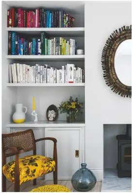  ??  ?? FAMILY ROOM Books are arranged to bring a rainbow of colour.
Mirror, £220, Maisons du Monde. Eve candlehold­er, £78, Jonathan Adler