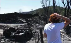  ?? AFP ?? A resident surveys the damage to homes in Bormes-lesMimosas in the south-east Provence-Alpes-Cote D’Azur