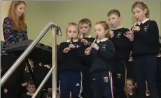  ??  ?? Teacher Marie Torpey and the school’s flute group.