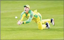  ??  ?? Australia’s Marnus Labuschagn­e takes the catch to dismiss England’s Jos Buttler during the first ODI cricket match between England and Australia at
Old Trafford in Manchester, England on Sept 11. (AP)