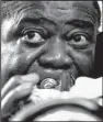  ?? Democrat-Gazette file photo ?? Louis Armstrong practices on a gold-plated trumpet in 1970.