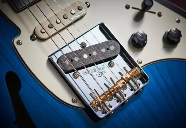  ??  ?? 1. This is clearly a standard Tele-style bridge, but at least we get compensate­d saddles for improved intonation. You also have the choice to through-string or top-load here