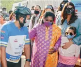  ?? ?? Governor Dr Tamilisai Soundarara­jan (centre) pats AMF founder Aditya Mehta (left) at the flagging off of the Infinity Ride for para-athletes in Hyderabad on Wednesday. Actress Lakshmi Manchu is to the right.