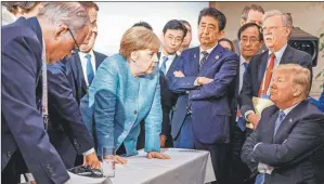  ?? ?? ICóNICA. Exasperada frente a Donald Trump en cumbre del G7.