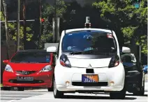  ??  ?? A nuTonomy self-driving taxi drives on the road in its public trial in Singapore on Aug. 25.