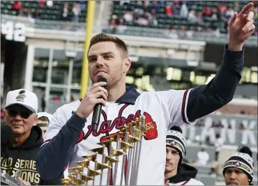  ?? ASSOCIATED PRESS FILE PHOTO ?? Atlanta Braves’ Freddie Freeman speaks during a celebratio­n earlier this month in Atlanta. He is now a free agent.