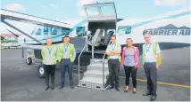  ??  ?? Grant Bacon (second from left) flies to Great Barrier Island 42 times a week.