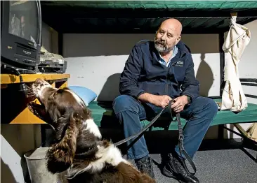  ?? CHRISTEL YARDLEY/ STUFF ?? Correction­s Central region dog section supervisor Steve Shadbolt does random drug checks throughout central prisons with his dog Ciggie.