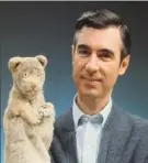  ?? Focus Features ?? Fred Rogers with Daniel Tiger in “Won’t You Be My Neighbor?”