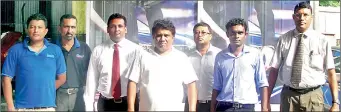  ??  ?? The Milroy Auto Engineers team with representa­tives from Lankem Paints Ltd, sole agent for Sherwin-Williams Auto Refinish products in Sri Lanka