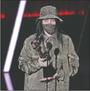  ??  ?? Billie Eilish accepts the award for top Billboard 200 album for “When We All Fall Asleep, Where Do We Go?” at the Billboard Music Awards on Oct. 14 at the Dolby Theatre in Los Angeles.