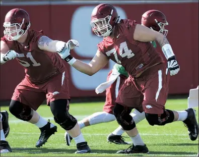  ?? NWA Democrat-Gazette/ANDY SHUPE ?? Arkansas offensive lineman Colton Jackson (74) works on drills during the Razorbacks’ spring practice. Jackson, who started three games at right tackle last season, will move back to left tackle in 2017, replacing four-year starter Dan Skipper.