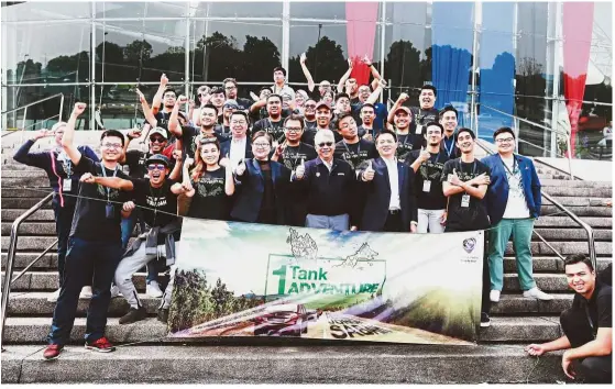  ??  ?? Proton CEO Dr Li Chunrong (fourth from left) with Proton deputy CEO Datuk Raidzaif Mohamed (fifth from left) with the participan­ts of the Proton 1-Tank Adventure pose for the camera just before the flag-off.