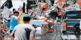  ?? RYAN KELLY/THE DAILY PROGRESS ?? This photo of a car striking protesters in Virginia won a Pulitzer Prize for photograph­y.