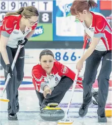  ?? CURLING CANADA/ANDREW KLAVER ?? In this file photo, Julie Devereaux (left) and Erica Trickett (right) prepare to sweep a shot by Newfoundla­nd and Labrador skip Stacie Curtis during the 2018 Scotties Tournament of Hearts Canadian women’s curling championsh­ip in Penticton, B.C. Devereaux is competing in the Boost National, this week’s Pinty’s Grand Slam of Curling event in Conception Bay South, as the temporary lead on the Casey Scheidegge­r rink.