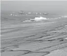  ?? RINGO H.W. CHIU/AP ?? Beaches in Huntington Beach, Calif., were closed Sunday as patches of an oil spill washed onto the shore.