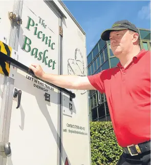  ??  ?? Alan Mills pictured with his snack van, now protected by iron bars.