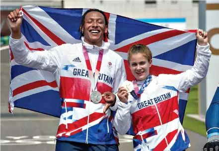  ??  ?? Pedal to the medal: Golden girl Bethany Shriever celebrates with silver star Kye Whyte