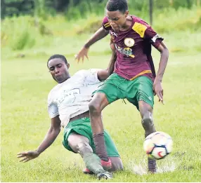  ?? PHOTO BY ASHLEY ANGUIN ?? Frome Technical High’s Romario Burgess (left) makes a tackle on goalscorer Devaunie Brown (right) during their ISSA/WATA DaCosta Cup match at the Frome Sports Complex on Thursday, October 4. The game ended 1-1.