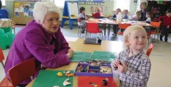  ?? ROB O’FLANAGAN/GUELPH MERCURY ?? Education Minister Liz Sandals took some time to play with Brock Clarke, 2, during a visit to Parkview Daycare in Guelph on Friday, where she made a wage increase announceme­nt for early childhood education workers.