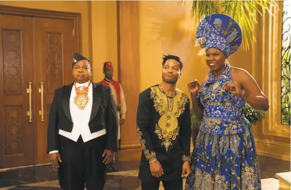 ?? Amazon Studios ?? Paul Bates (left) as Oha reprises his role from the original 1988 movie in “Coming 2 America,” with Jermaine Fowler as King Akeem’s newly discovered American son, Lavelle, and Leslie Jones as Lavelle’s mother.
