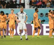  ?? MARTIN MEISSNER/AP ?? Tim Ream of the United States reacts after the third goal against his team during the World Cup round of 16 soccer match between the Netherland­s and the United States on Saturday at the Khalifa Internatio­nal Stadium in Doha, Qatar.