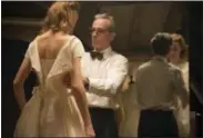  ?? LAURIE SPARHAM — FOCUS FEATURES VIA AP ?? In this image released by Focus Features, Vicky Krieps, left, and Daniel Day-Lewis appear in a scene from “Phantom Thread.”