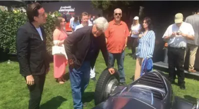  ?? NORRIS MCDONALD/TORONTO STAR ?? Jay Leno, former host of the Tonight Show and a celebrated car guy, couldn’t stay away from the Infiti Prototype 9 1930s-era concept racing car. Here, he talks with head of global design for Infiniti, Alfonso Albaisa, about the car while his family and...