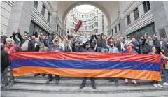  ?? AFP ?? Opposition supporters block the Armenian Foreign Ministry building during anti-government rallies in the capital Yerevan on May 24.