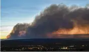  ?? ROBERT BROWMAN / THE ALBUQUERQU­E JOURNAL ?? Smoke from the Calf Canyon/Hermits Peak Fire drifts over Las Vegas, N.M., on Saturday.