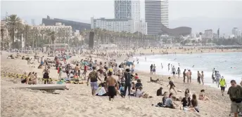  ??  ?? People enjoy a morning out at La Barcelonet­a Beach in Barcelona.