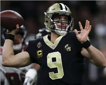  ?? CHRIS GRAYTHEN — GETTY IMAGES ?? Drew Brees threw for just 3,992 yards this season — a low number for him — but completed an NFL record 74.4 percent of his throws.