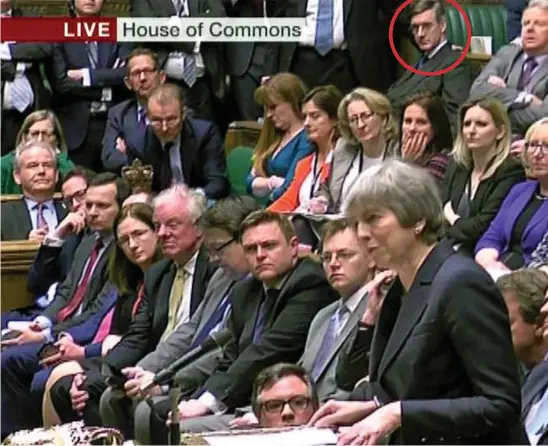  ??  ?? Packed House: Prime Minister Theresa May addresses the Commons after last night’s votes, as leading Tory Brexiteer Jacob Rees-Mogg (circled) looks on from the backbenche­s