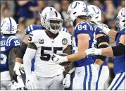  ?? DOUG MCSCHOOLER — THE ASSOCIATED PRESS ?? Raiders outside linebacker Vontaze Burfict speaks with Indianapol­is Colts tight end Jack Doyle (84) after his helmet-to-helmet hit on Doyle in Sunday’s game.