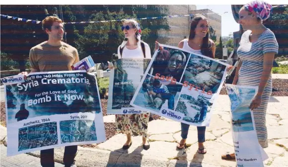  ??  ?? A PROTEST outside the Knesset last week organized by The World Values Network demanding that Israel take action against the Syrian crematoria.