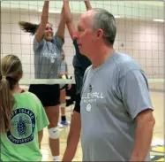  ?? Photos by LARRY GREESON / For the Calhoun TImes ?? ( ABOVE) Calhoun head volleyball coach Randy Rice oversees drills at Calhoun Volleyball Camp on Wednesday morning. ( LEFT) Camper Kaiya Montes works on passing during a drill on Wednesday at Calhoun Volleyball Camp.