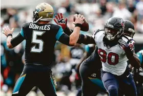  ?? Brett Coomer / Staff photograph­er ?? Texans linebacker Jadeveon Clowney, right, is hoping for a better outcome against Jaguars quarterbac­k Blake Bortles than he experience­d last season.