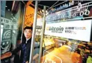  ?? HUANG XIAO / FOR CHINA DAILY ?? A coffee shop in Shenzhen, Guangdong province, announces that Bitcoins are accepted for payment.