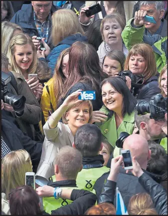  ??  ?? First Minister Nicola Sturgeon takes a selfie with SNP activists in Glasgow
